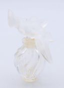 A Lalique L'Air du Temps Nina Ricci scent bottle. 7.75 cm high.