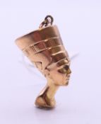 A 9 ct gold bust of Nefertiti pendant. 3.5 cm high. 6.2 grammes.