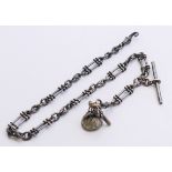 A silver pocket watch Albert chain with fob and watch key. 37 cm long.