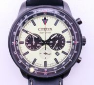 A Citizen Eco-Drive black rim gentleman's wristwatch, boxed. 4.5 cm wide.