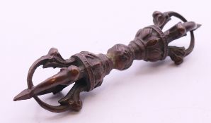 A Tibetan bronze vajra. 10.5 cm long.