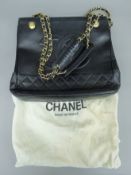 A 1990's Chanel black shoulder bag with leather and chain straps, serial no.