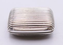 A 19th century silver-plated reeded decorated snuff box with gilded interior. 4 x 5.5 cm.