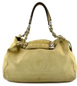 A Chanel Hobo beige leather XL handbag with stitched CC logo, white metal fastenings,
