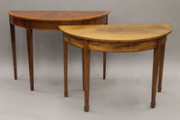 A 19th century mahogany demi-lune side table and a reproduction demi-lune side table.