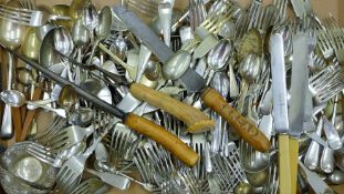A quantity of various silver-plated cutlery, a bread knife etc. The latter 31 cm long.