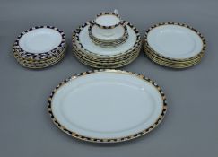 A quantity of early 20th century porcelain dinnerwares. The largest plate 37 cm long.