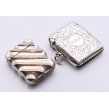 A silver-plated Art Deco fluted spring-loaded vesta case together with one other silver vesta.