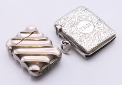 A silver-plated Art Deco fluted spring-loaded vesta case together with one other silver vesta.