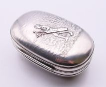 An American silver box, the lid embossed with a caddy carrying golf clubs on a golf course,