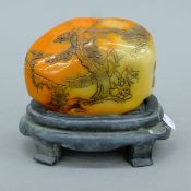 A Chinese seal on stand. 12 cm long.