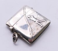 An Edwardian 925 silver vesta with golf motif. 3.