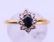 A 22 ct gold ring set with sapphire cluster. 2.2 grammes total weight. Ring size O.