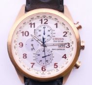 A gentleman's Citizen Eco-Drive gold rim wristwatch. 4.5 cm wide.