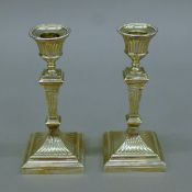 A pair of silver candlesticks. 16 cm high.