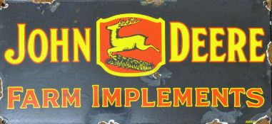 An enamel John Deere sign. 45 x 21 cm.