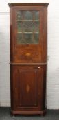 A Victorian inlaid mahogany corner cabinet. 223 cm high.