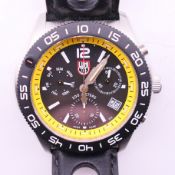 A gentleman's Luminox wristwatch, boxed, with spare strap. 5 cm wide.
