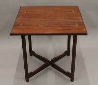 An early 20th century mahogany folding table with tray base. 76 cm long.
