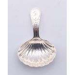 A silver George III caddy spoon with shell-shaped bowl, circa 1803. 8 cm high.