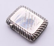 An Edwardian silver vesta with ribbed decoration and inscribed B S THEAKER,