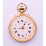 An 18 ct gold pocket watch with white dial and engraved decoration to case. 3.25 cm diameter.