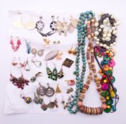 A quantity of earrings and necklaces.