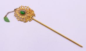 A jade mounted hairpin. 19 cm long.