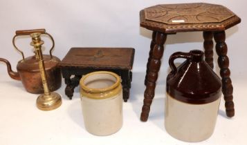 Two oak stools with carved decoration to the tops, copper kettle, brass candlestick, stoneware