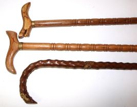 Medlar wood walking stick with applied gilt lizards, marked MISPEL, and two others, max. H93cm (3)
