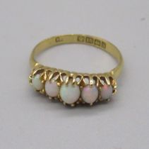18ct yellow gold ring set with five cabochon opals, stamped 18, size N1/2, 2.6g