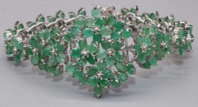 Hallmarked Sterling silver bracelet set with one hundred and twenty six marquise cut emeralds,