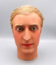 Early C20th male French wax mannequin head, with real hair, glass eyes and painted face, c1930s,