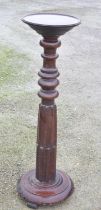 Late C19th mahogany torchiere with circular top, turned and fluted column on circular base. H80cm