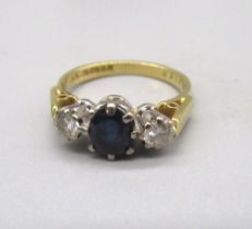 18ct yellow gold sapphire and diamond three stone ring, stamped 750, size J, 3.3g