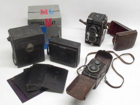 Boxed Yashica-Mat LM camera no. MTL 2050401, Franke & Heidecke Rollieflex camera no. 136556 and an