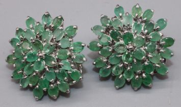 Pair of Sterling silver floral cluster earrings set with seventy oval emeralds, stamped 925, 13.5g