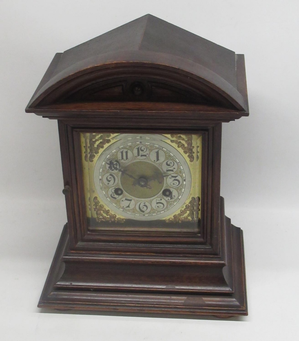 Junghans - early C20th oak arched top mantle clock, bevelled glazed panel door enclosing brass