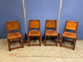 Robert Mouseman Thompson of Kilburn - a set of four oak dining chairs, with adzed panel backs, and