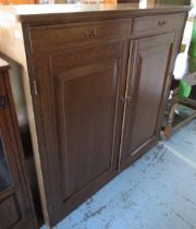 Victorian grained as oak pine cupboard, two frieze drawers above a pair of fielded panel doors, with