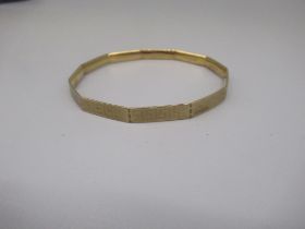 LW&G Lagarmic 9ct gold bronze core bangle, with Greek Key design, stamped 9c