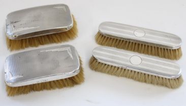 Four post 1920s hallmarked silver backed dressing table brushes with engine turned decoration, max