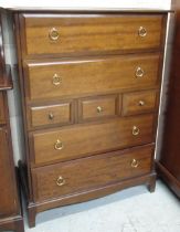 Stag Minstrel bedroom furniture comprising; Two door wardrobe, dressing table, bedside cabinet and