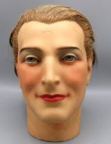 Early C20th male plaster mannequin head, with real hair, glass eyes and painted face, c1930s, H26cm