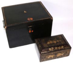 Two C19th black lacquered Chinese boxes, one gilt decorated with figures in a courtyard, L33cm and