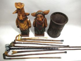 Collection of walking sticks and a golf putter stamped 'J Kay Seaton Carew Special'; faux leather