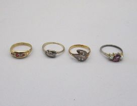 9ct yellow gold ring set with red and clear stones, size K, stamped 375, a yellow metal ring with