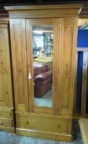 Arts and Crafts ash wardrobe, with black painted detail, moulded cornice and mirror door above a