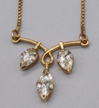 Yellow metal necklace with diamond centre piece, the central marquise cut diamond flanked by two