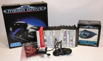 Sega Mega Drive 1 TV games console with control pad, Sega Mega Drive Master System Converter, and